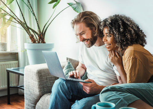 Couple looking at laptop for fixed fees